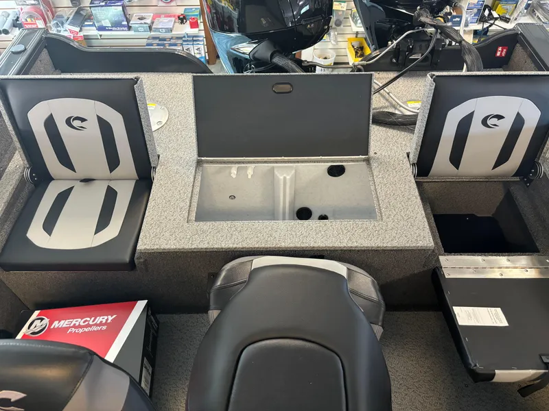 Slide: The Image of 2025 Crestliner 1750 Fish Hawk WT JS boat interior with seating and storage compartments. - 3