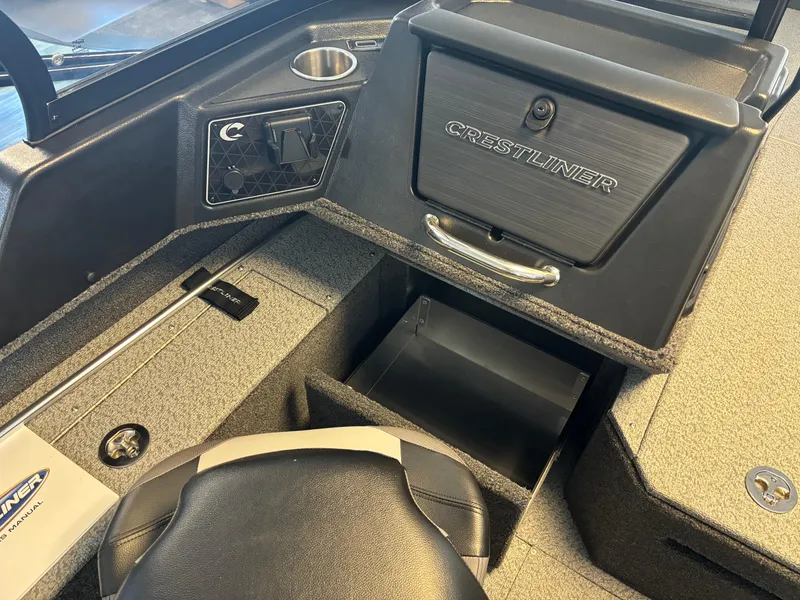 Slide: The Image of Interior of 2025 Crestliner 1750 Fish Hawk WT JS boat, featuring storage compartments. - 4