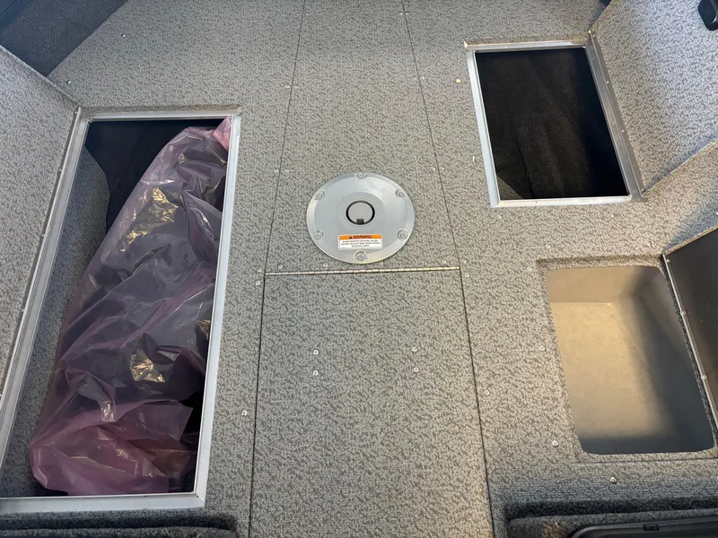 Slide: The Image of 2025 Crestliner 1750 Fish Hawk WT JS boat interior with storage compartments. - 7