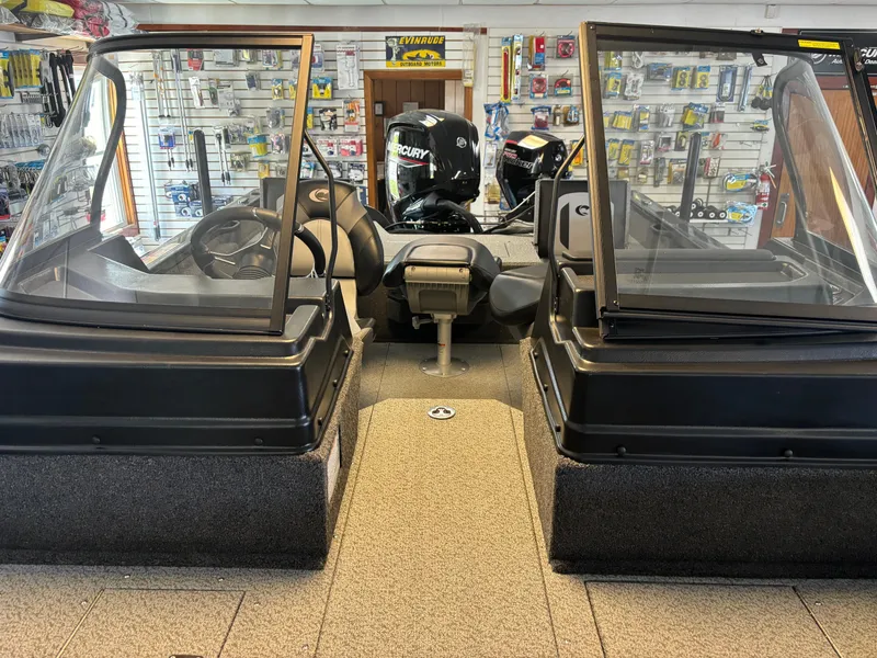 Slide: The Image of 2025 Crestliner 1750 Fish Hawk WT JS boat interior with dual consoles and Mercury engine. - 8