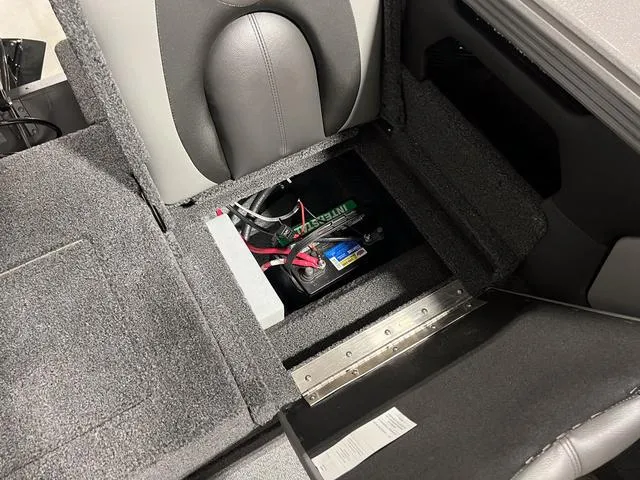 Slide: The Image of 2025 Lund 2075 Tyee Sport boat interior with battery compartment exposed. - 10