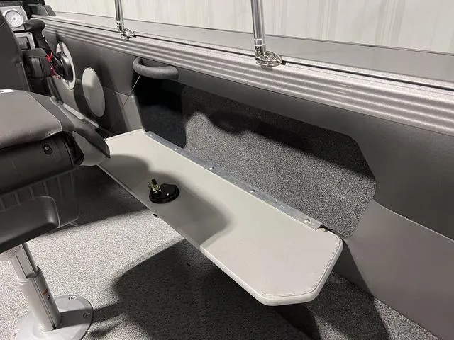 Slide: The Image of Interior of 2025 Lund 2075 Tyee Sport boat, featuring seating and storage area. - 15