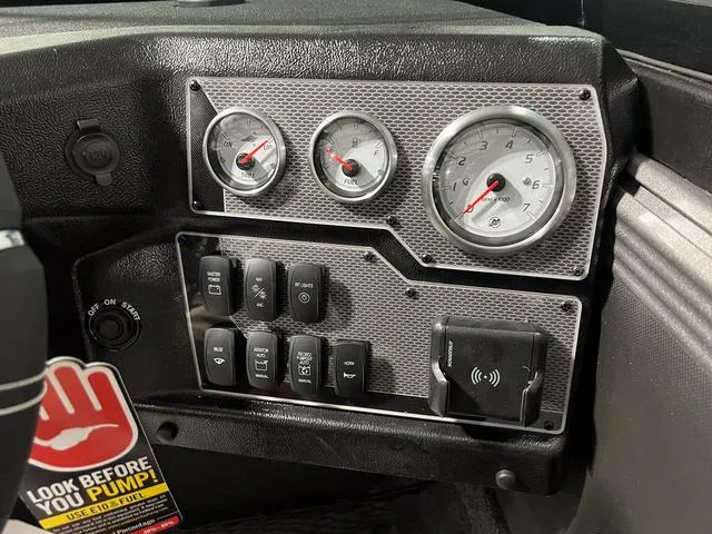 Slide: The Image of Dashboard of 2025 Lund 2075 Tyee Sport boat with gauges and controls. - 19