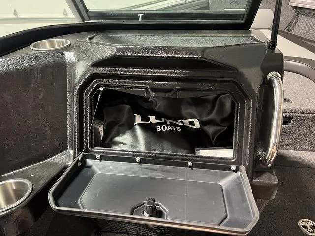 Slide: The Image of 2025 Lund 2075 Tyee Sport boat storage compartment with logo bag. - 23