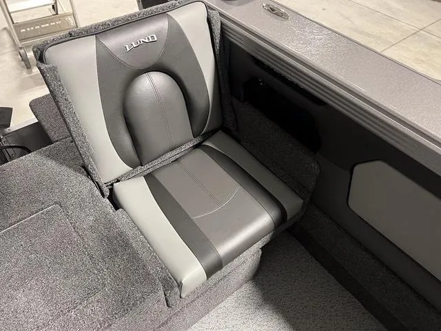 Slide: The Image of 2025 Lund 2075 Tyee Sport boat seat, gray and black upholstery, modern design. - 9