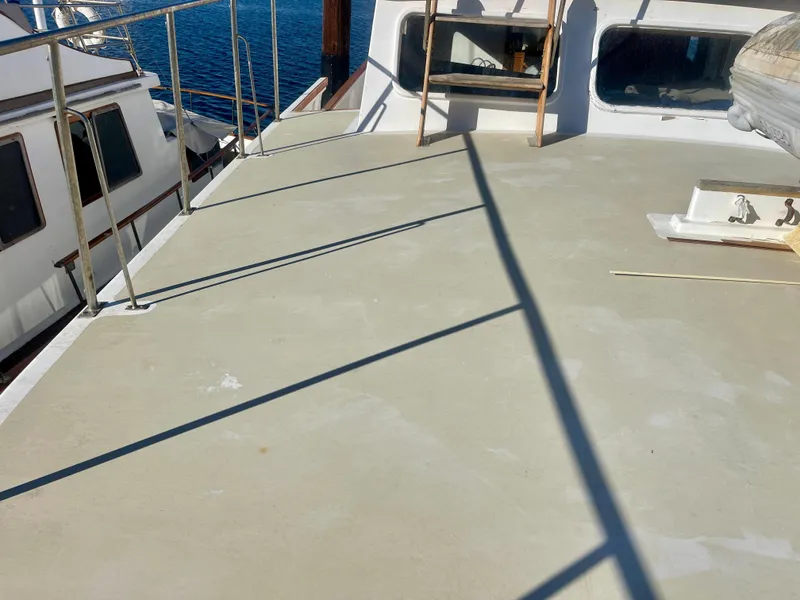 Slide: The Image of 1977 Grand Alaskan Raised Pilothouse deck with railing and ocean view. - 27