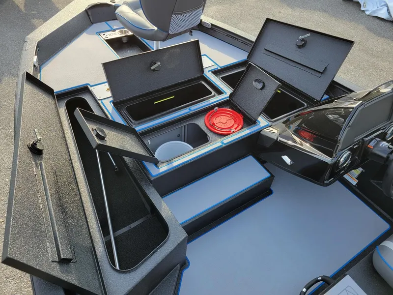 Slide: The Image of 2025 Xpress H17C Crappie boat interior with open storage compartments. - 12