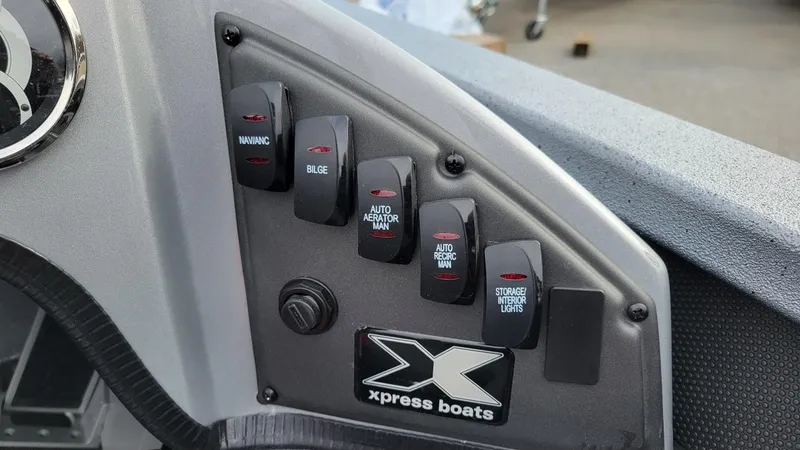 Slide: The Image of Control panel of 2025 Xpress X19 Pro boat with labeled switches. - 10