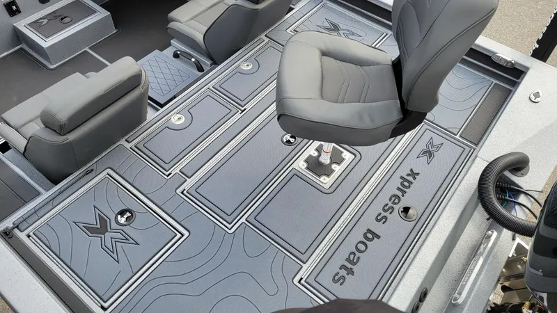 Slide: The Image of 2025 Xpress X19 Pro boat interior with Yamaha Vmax 175, featuring sleek seating and storage. - 11