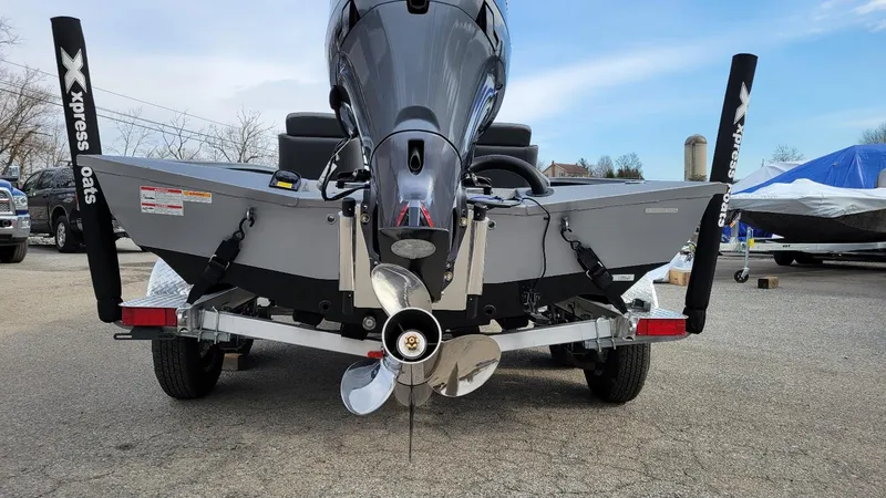 Slide: The Image of 2025 Xpress X19 Pro boat with Yamaha Vmax 175 engine, rear view on trailer. - 15