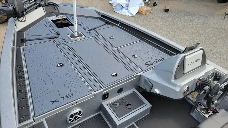 Slide: The Image of 2025 Xpress X19 Pro boat interior with Garmin system and SeaDek flooring. - 16