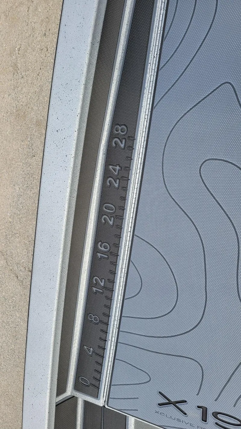 Slide: The Image of 2025 Xpress X19 Pro boat deck with measurement scale and contour design. - 19