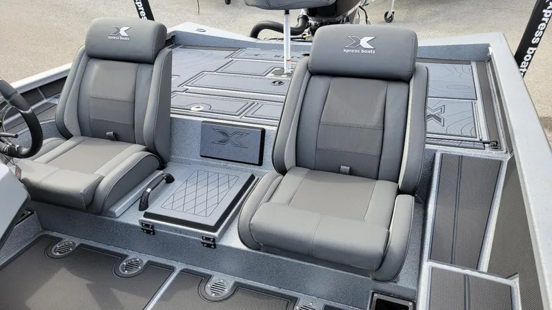 Slide: The Image of 2025 Xpress X19 Pro boat interior with dual gray seats and Yamaha Vmax 175 engine. - 8