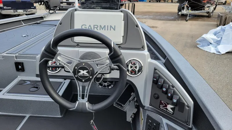 Slide: The Image of 2025 Xpress X19 Pro boat dashboard with Garmin display and Yamaha Vmax 175 controls. - 9