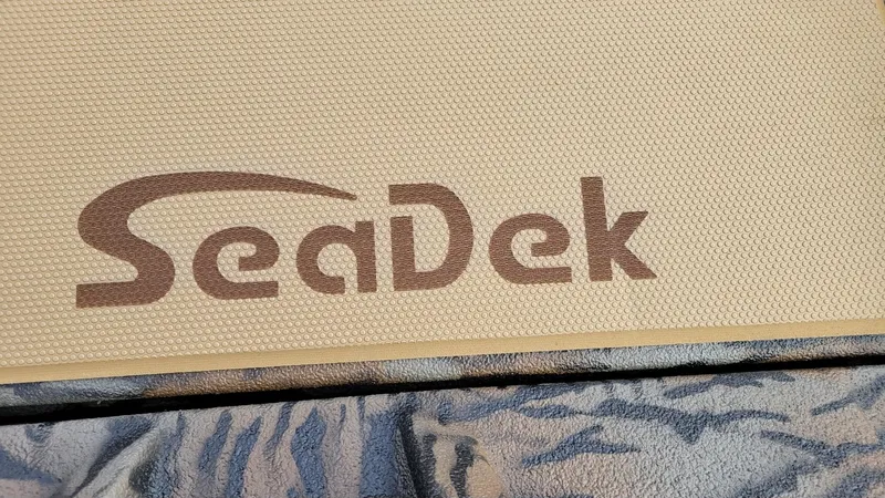 Slide: The Image of SeaDek logo on textured surface of 2025 Xpress H17 Bass boat. - 11