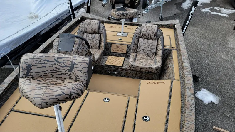 Slide: The Image of 2025 Xpress H17 Bass boat interior with camo seats and Yamaha Vmax 90 SHO engine. - 13