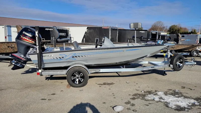 The Image of 2025 Xpress H17 Bass boat with Yamaha Vmax 90 SHO engine on trailer. - 1