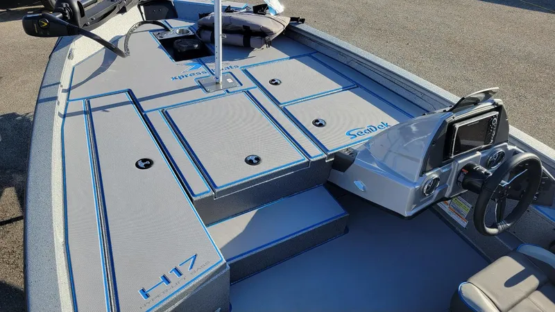 Slide: The Image of 2025 Xpress H17 Bass boat interior with SeaDek flooring and Yamaha Vmax 90 SHO engine. - 13