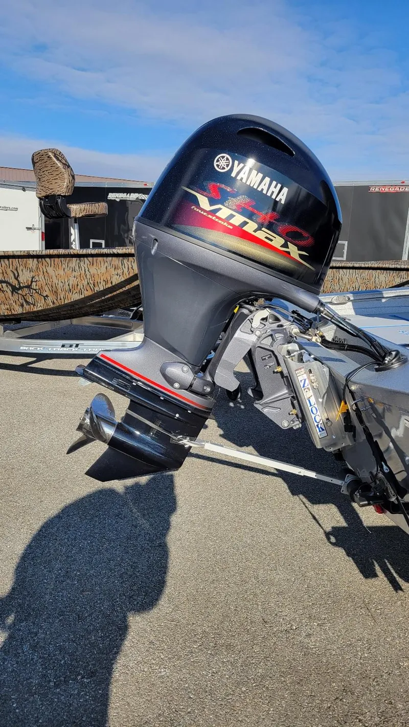 Slide: The Image of 2025 Xpress H17 Bass boat with Yamaha Vmax 90 SHO engine, parked outdoors. - 4