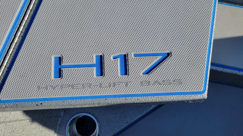 Slide: The Image of 2025 Xpress H17 Bass boat deck with blue accents. - 9