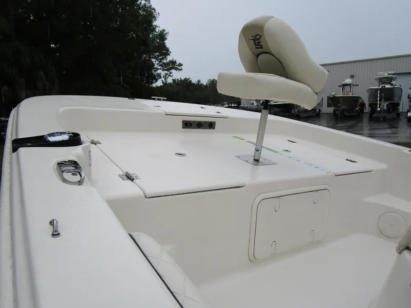 Slide: The Image of 2022 Carolina Skiff 19 LS boat interior with seating and storage compartments. - 3