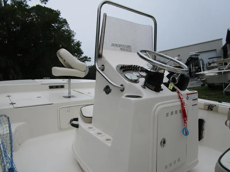 Slide: The Image of 2022 Carolina Skiff 19 LS boat console with steering wheel and controls. - 4