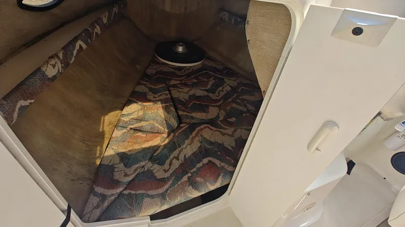 Slide: The Image of Interior cabin of 1997 Rinker Festiva 212 boat with patterned upholstery. - 11