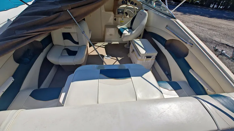 Slide: The Image of Interior of a 1997 Rinker Festiva 212 boat with seating and steering area. - 5