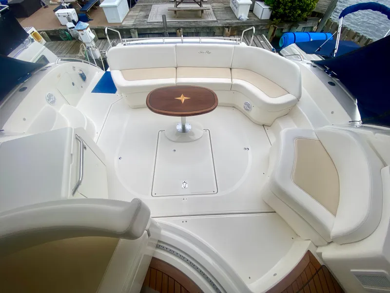 Slide: The Image of Luxurious seating area on 2013 Sea Ray 580 Sundancer yacht with elegant table. - 22