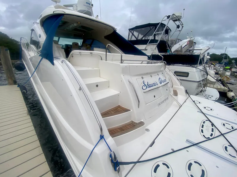 Slide: The Image of 2013 Sea Ray 580 Sundancer yacht docked at marina, rear view. - 15