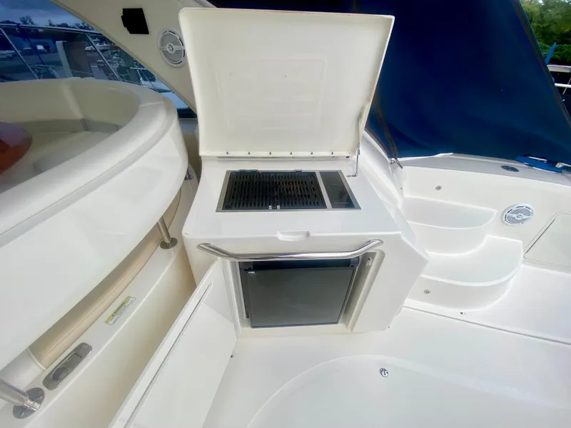 Slide: The Image of Sea Ray 580 Sundancer 2013 yacht with outdoor grill and seating area. - 28