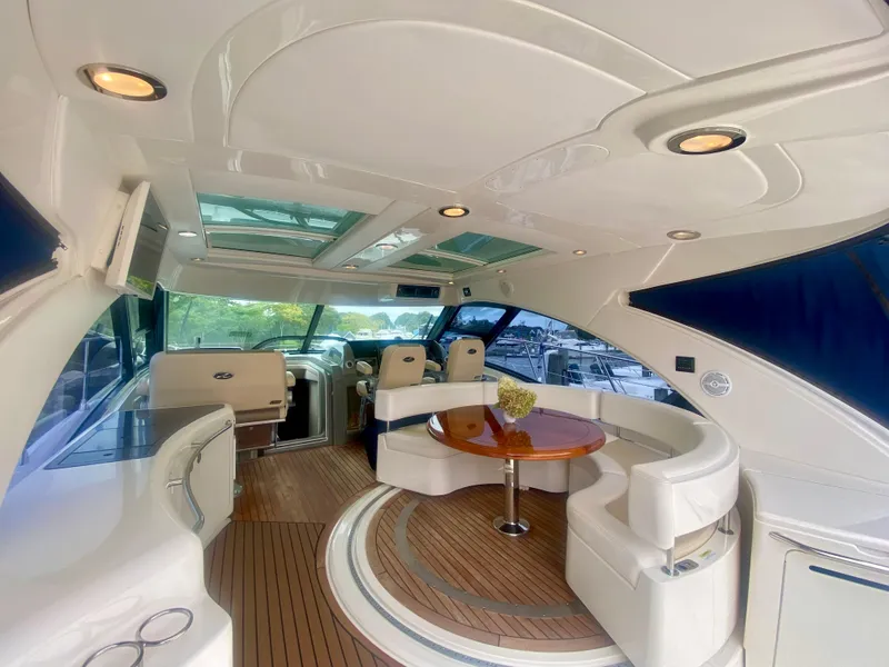 Slide: The Image of Luxurious interior of 2013 Sea Ray 580 Sundancer yacht with elegant seating and wood flooring. - 26