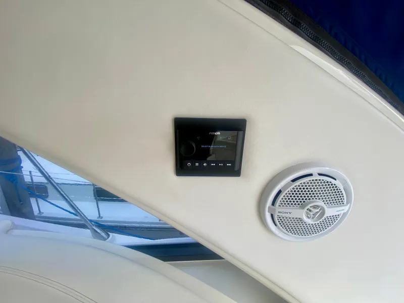 Slide: The Image of Interior of 2013 Sea Ray 580 Sundancer with audio control panel and speaker. - 34