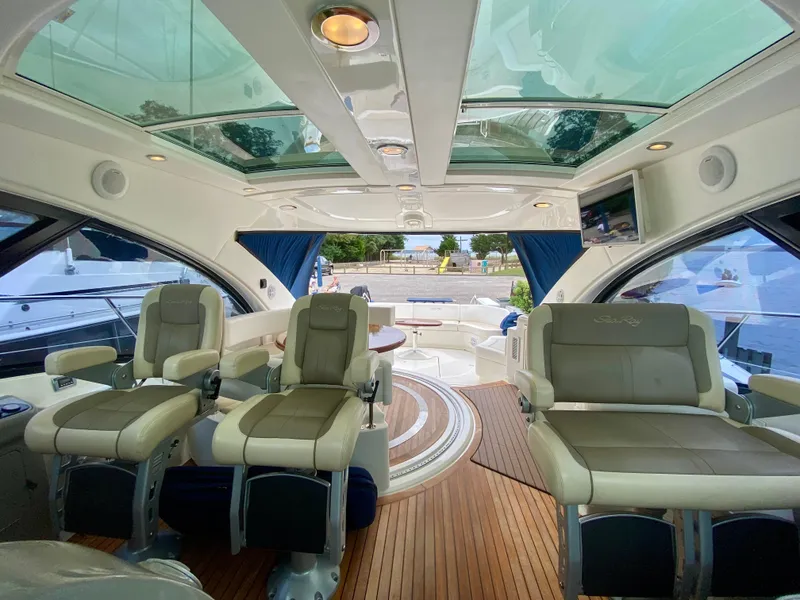 Slide: The Image of Luxurious interior of 2013 Sea Ray 580 Sundancer yacht with leather seating and wood flooring. - 37