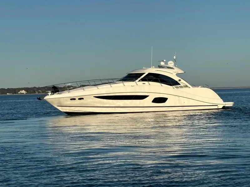 The Image of 2013 Sea Ray 580 Sundancer yacht cruising on calm waters. - 0