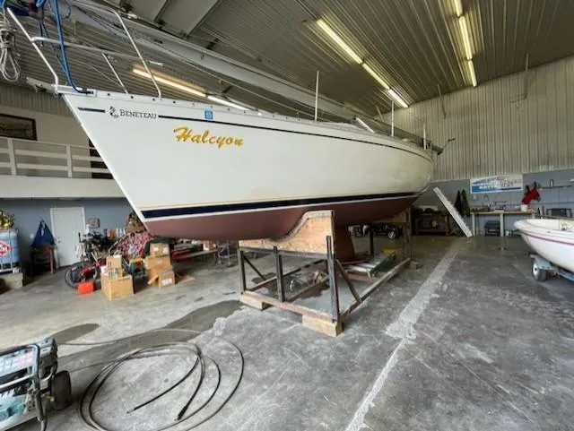 Slide: The Image of 1989 Beneteau First 285 sailboat in a workshop, named "Halcyon." - 12
