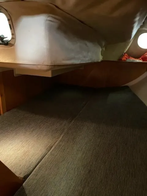 Slide: The Image of Interior cabin of 1989 Beneteau First 285 sailboat, featuring cozy sleeping area. - 5