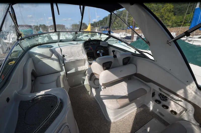 Slide: The Image of 2011 Crownline 280 CR boat interior with helm, seating, and dashboard. - 3