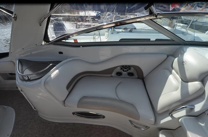 Slide: The Image of 2011 Crownline 280 CR boat interior with plush seating and modern design. - 7