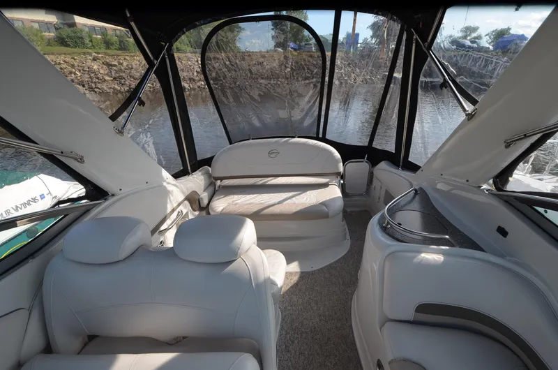 Slide: The Image of Interior of 2011 Crownline 280 CR boat with white seating and panoramic windows. - 8