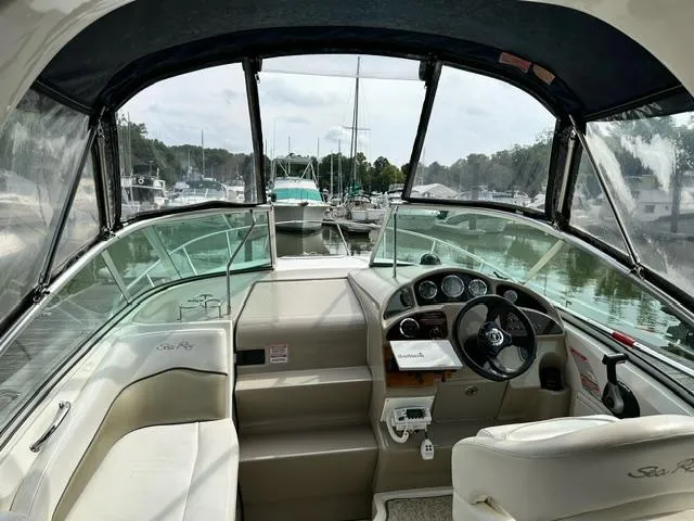 Slide: The Image of 2006 Sea Ray 260 Sundancer boat interior with steering wheel and dashboard. - 7