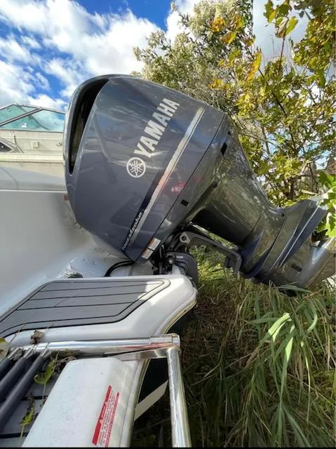 Slide: The Image of 2022 Tidewater 232 LXF boat with Yamaha outboard motor in natural setting. - 7