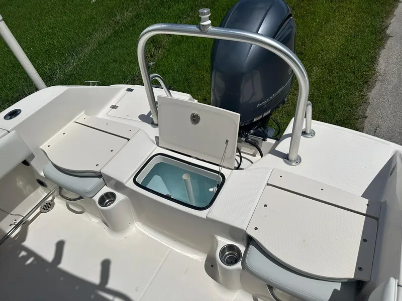 Slide: The Image of 2016 Robalo R200 Center Console boat interior with engine and seating. - 12