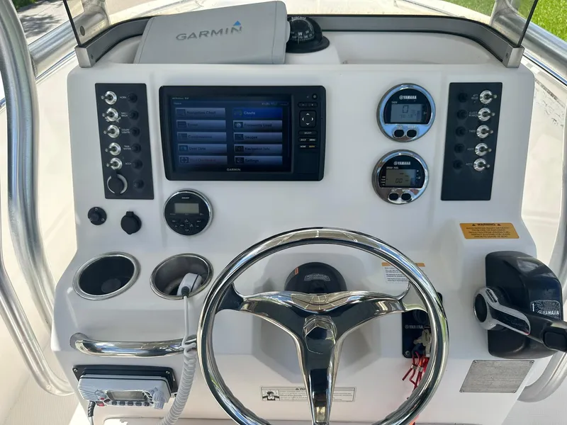 Slide: The Image of 2016 Robalo R200 Center Console dashboard with Garmin navigation and control instruments. - 15