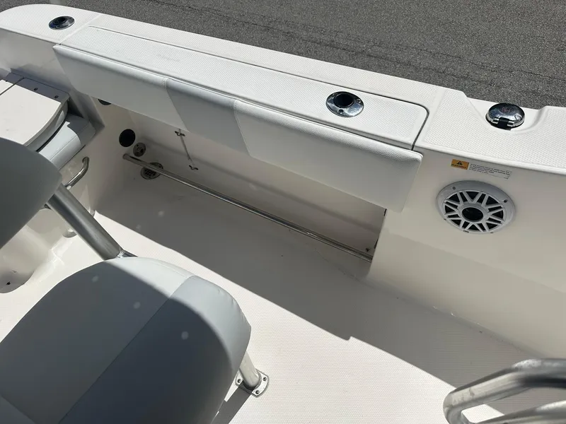 Slide: The Image of 2016 Robalo R200 Center Console boat interior with seating and speaker. - 17