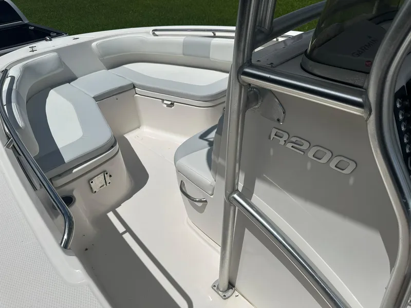 Slide: The Image of 2016 Robalo R200 Center Console boat interior with seating and console details. - 18