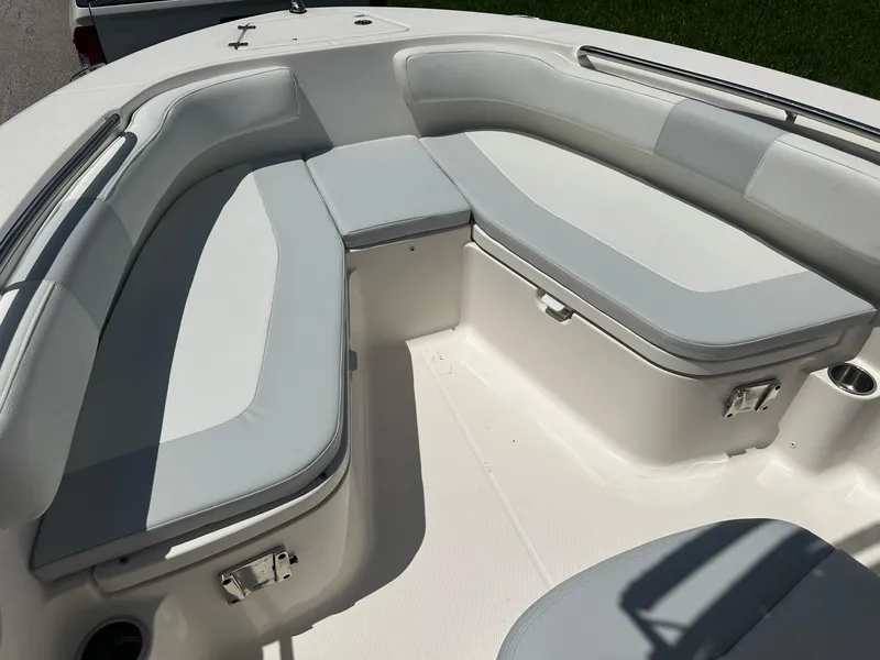 Slide: The Image of 2016 Robalo R200 Center Console boat with cushioned seating area. - 19