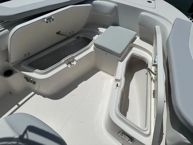 Slide: The Image of 2016 Robalo R200 Center Console boat interior with open storage compartments. - 20