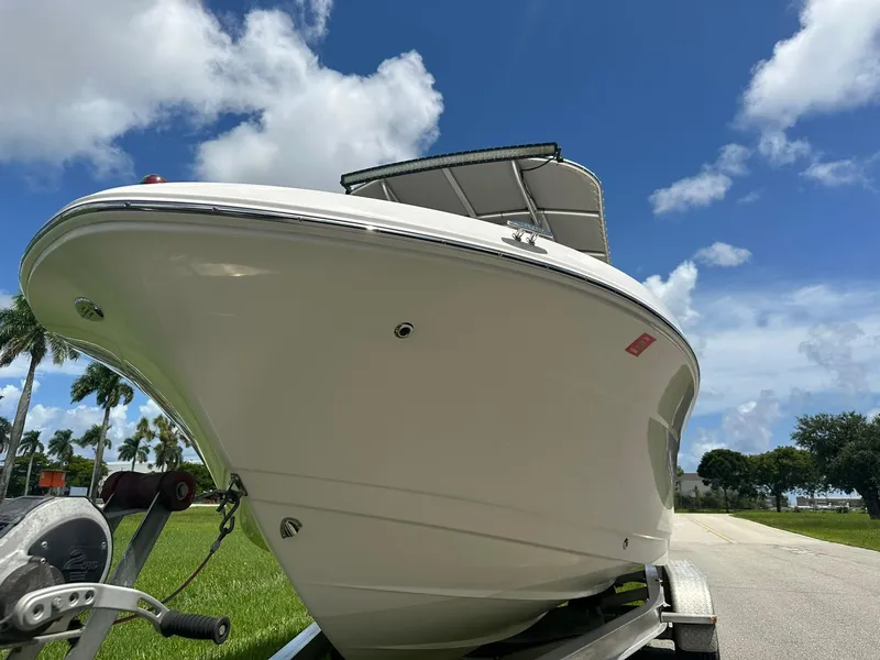 Slide: The Image of 2016 Robalo R200 Center Console boat on trailer under blue sky. - 8