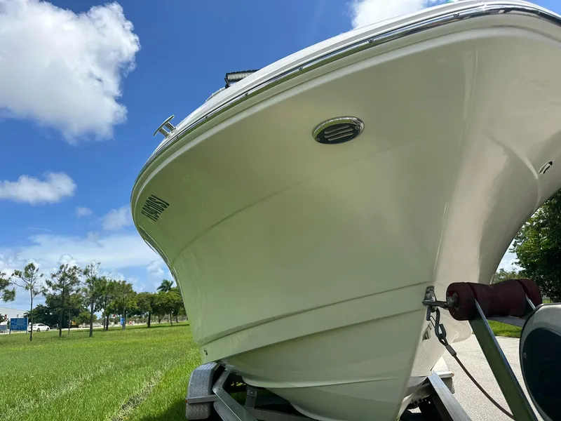 Slide: The Image of 2016 Robalo R200 Center Console boat on trailer under blue sky. - 9